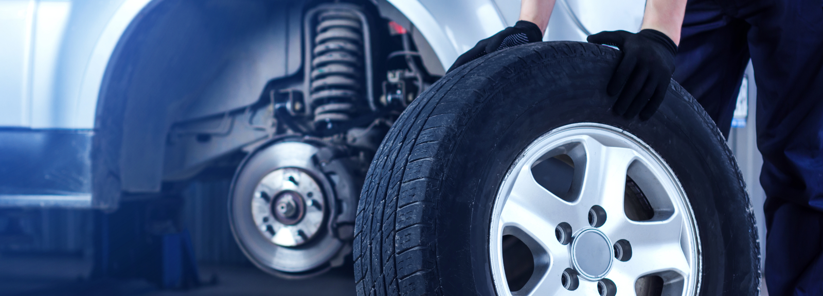 Mechanic holding a tyre - Tyres Colwick, Nottingham